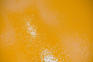 Selective focus on the yellow floor of freshly applied epoxy mortar system